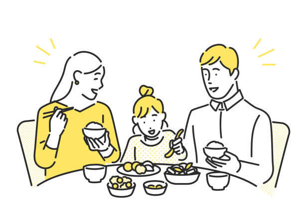 親子で食事する画像